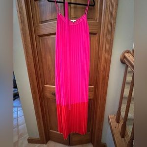 Boutique pleated sundress with belt. Never worn. Gorgeous rich colors.